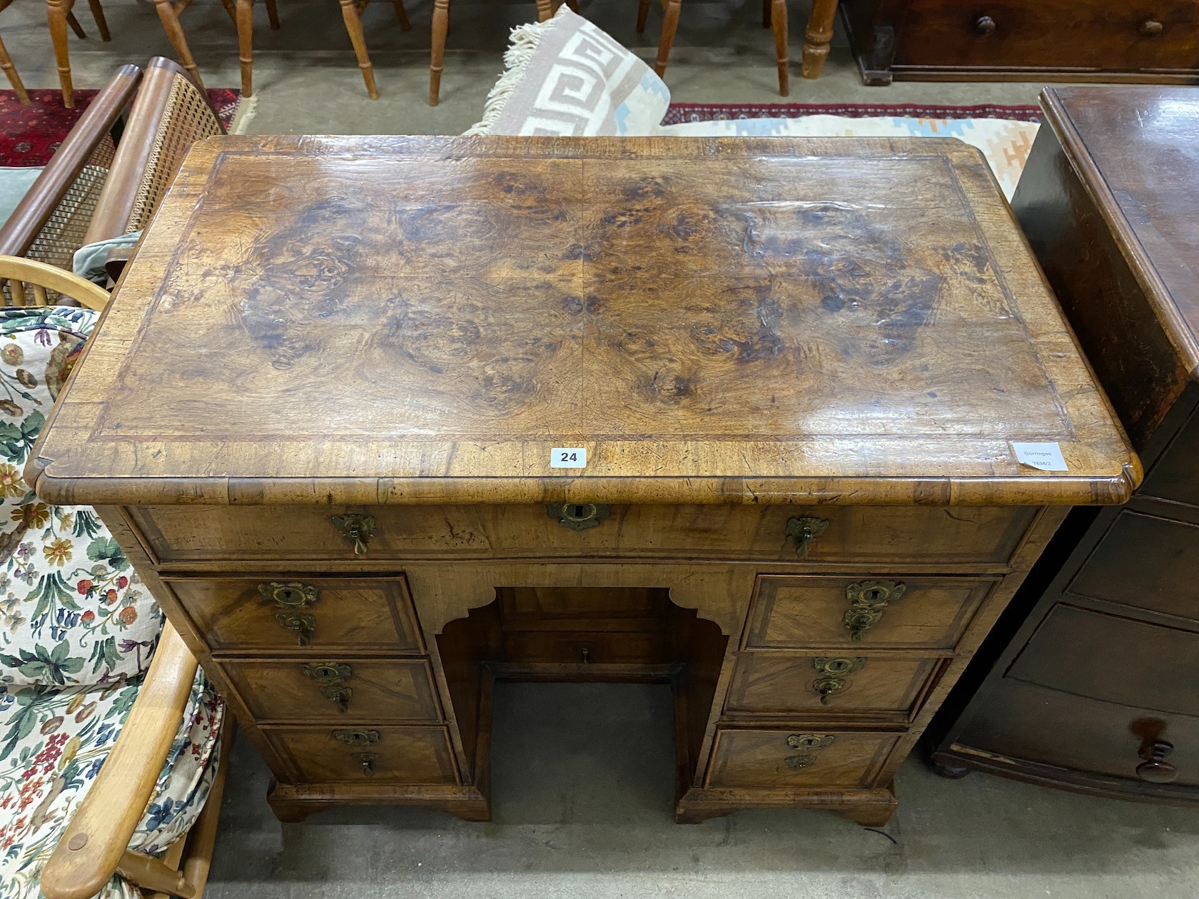 A George II feather banded walnut kneehole desk, length 99cm, depth 57cm, height 88cm